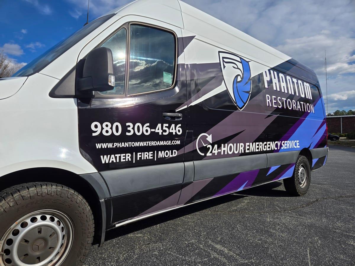 A Phantom Restoration van door listing water, fire and mold