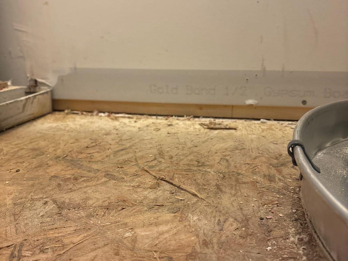 A room with the drywall cut away along the floor after flooding